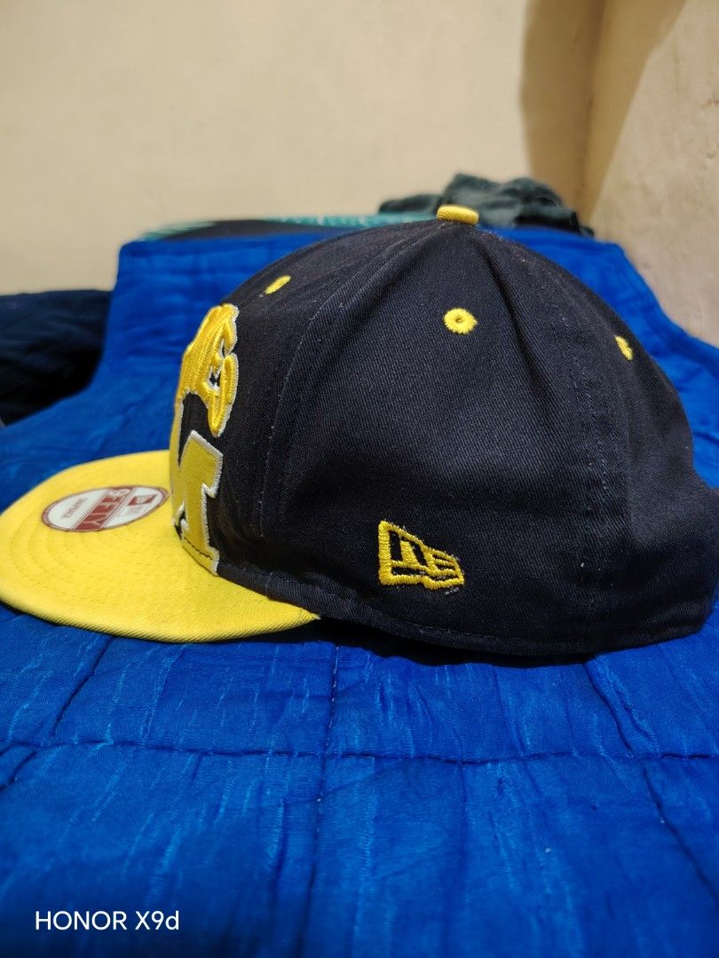 New Era 9FIFTY Wolverines Michigan Snapback Hat (Category: Caps & Hats) located in Manila. Submitted by thugluvin85 (Listing ID 1466196077, Image 3). Description: - Brand: New Era 9FIFTY Snapback - Team: Michigan Wolverines (Classic M logo embroidery) - Color: Black with vibrant yellow accents - Fit: Adjustable yellow snapback closure - Details: Embroidered side flag, structured crown with eyelets for ventilation - Condition: Brand new with origi