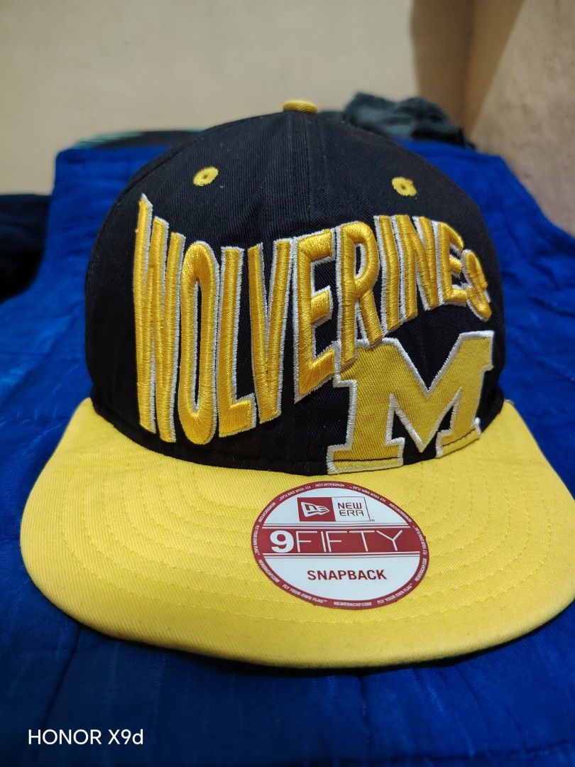 New Era 9FIFTY Wolverines Michigan Snapback Hat (Category: Caps & Hats) located in Manila. Submitted by thugluvin85 (Listing ID 1466196077, Image 1). Description: - Brand: New Era 9FIFTY Snapback - Team: Michigan Wolverines (Classic M logo embroidery) - Color: Black with vibrant yellow accents - Fit: Adjustable yellow snapback closure - Details: Embroidered side flag, structured crown with eyelets for ventilation - Condition: Brand new with origi