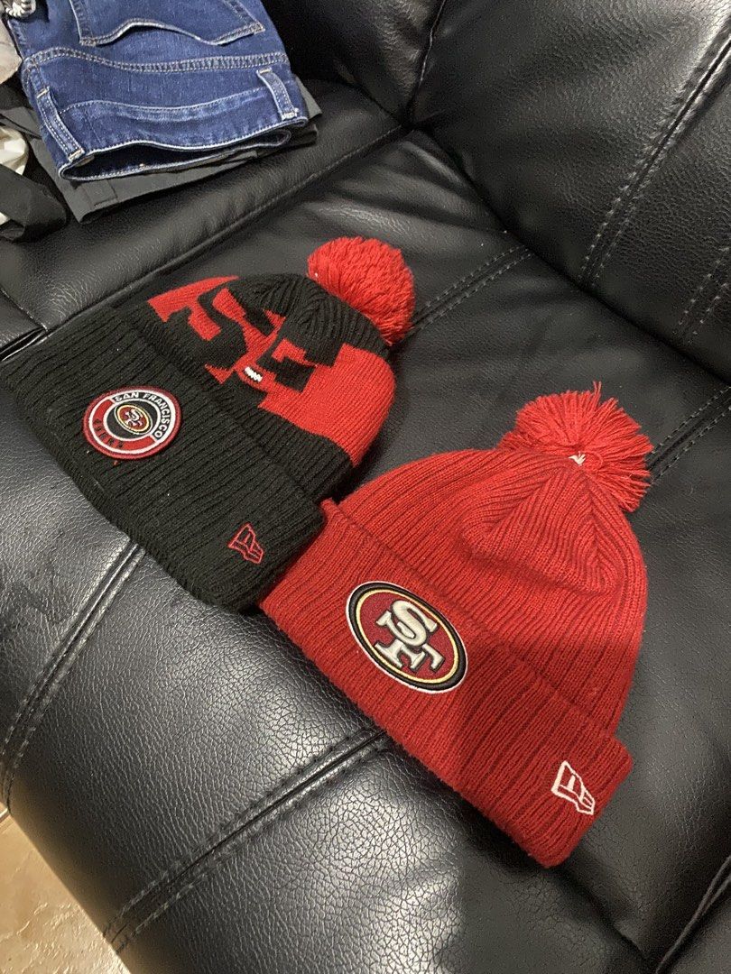 New era beanies for 800 aspack (Category: Caps & Hats) located in Antipolo. Submitted by switchneighborhood (Listing ID 1466294956, Image 1). Description: Two San Francisco 49ers knit beanies by New Era. One features a red and black colorway with bold 49ers lettering and an NFL patch. The other is solid red with the 49ers logo patch on the front cuff and the New Era flag on the side. Both have matching pom poms on top and a cozy grey fleece linin