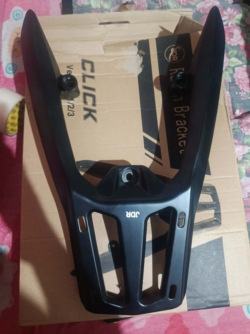 NEW JDR Rear Rack Bracket for Honda Click Version 1/2/3 (Category: Body Parts and Accessories) located in Rizal. Submitted by kairo214 (Listing ID 1466269833, Image 1). Description: - Compatible with Honda Click Version 1, 2, and 3 - Durable matte black finish - Heavy-duty solid metal construction - Includes mounting holes for easy setup - Box included and ready for installation.