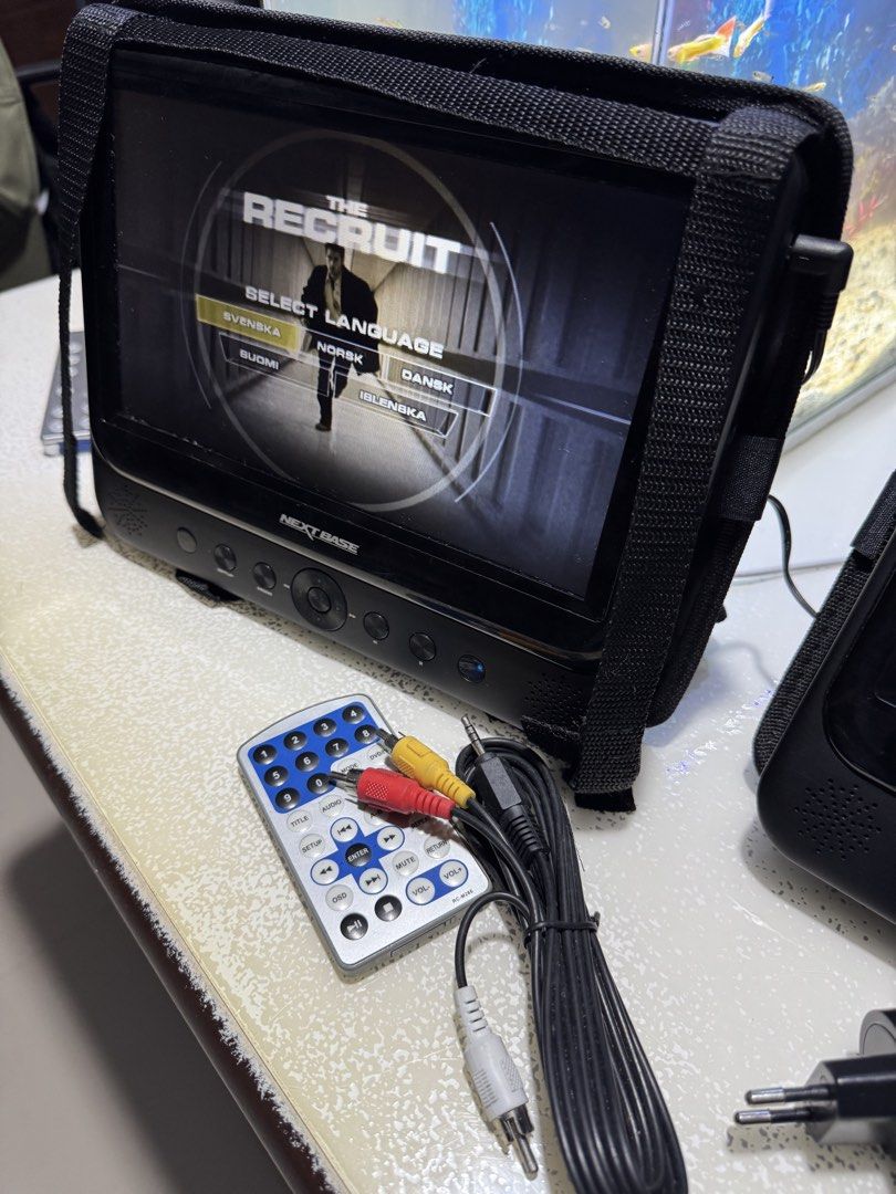 Nextbase SDV48 / SDV49 Portable DVD Player Twin System (Category: Blu-Ray & Media Players) located in Cavite. Submitted by marcuz1316 (Listing ID 1466254133, Image 2). Description: - Nextbase dual portable DVD player system - Includes two 9-inch screens and headrest mounting bags - Comes complete with power adapter, remote controls, and AV cables - Fully tested and working, perfect for long car journeys - Shows minor signs of previous use but 100