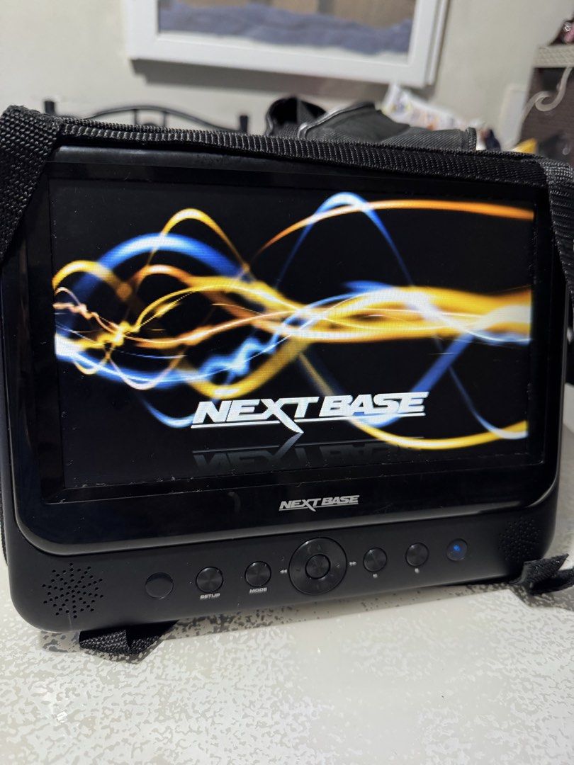 Nextbase SDV48 / SDV49 Portable DVD Player Twin System (Category: Blu-Ray & Media Players) located in Cavite. Submitted by marcuz1316 (Listing ID 1466254133, Image 3). Description: - Nextbase dual portable DVD player system - Includes two 9-inch screens and headrest mounting bags - Comes complete with power adapter, remote controls, and AV cables - Fully tested and working, perfect for long car journeys - Shows minor signs of previous use but 100