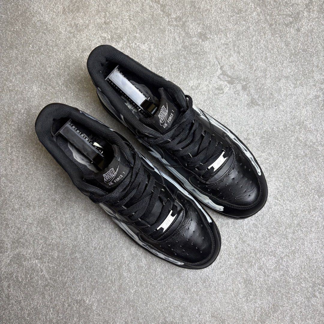 Nike Air Force 1 Black Skeleton (Category: Sneakers) located in Cagayan de Oro. Submitted by taramattsa45690 (Listing ID 1466157788, Image 2). Description: - Model: Nike Air Force 1 Halloween Edition - Colorway: Black with white skeleton foot graphic - Soles: Gum outsoles - Details: Black laces with silver AF1 dubraes - Condition: Minor creasing on the toe box, normal wear from previous use - Style: Rare and classic spooky aesthetic.