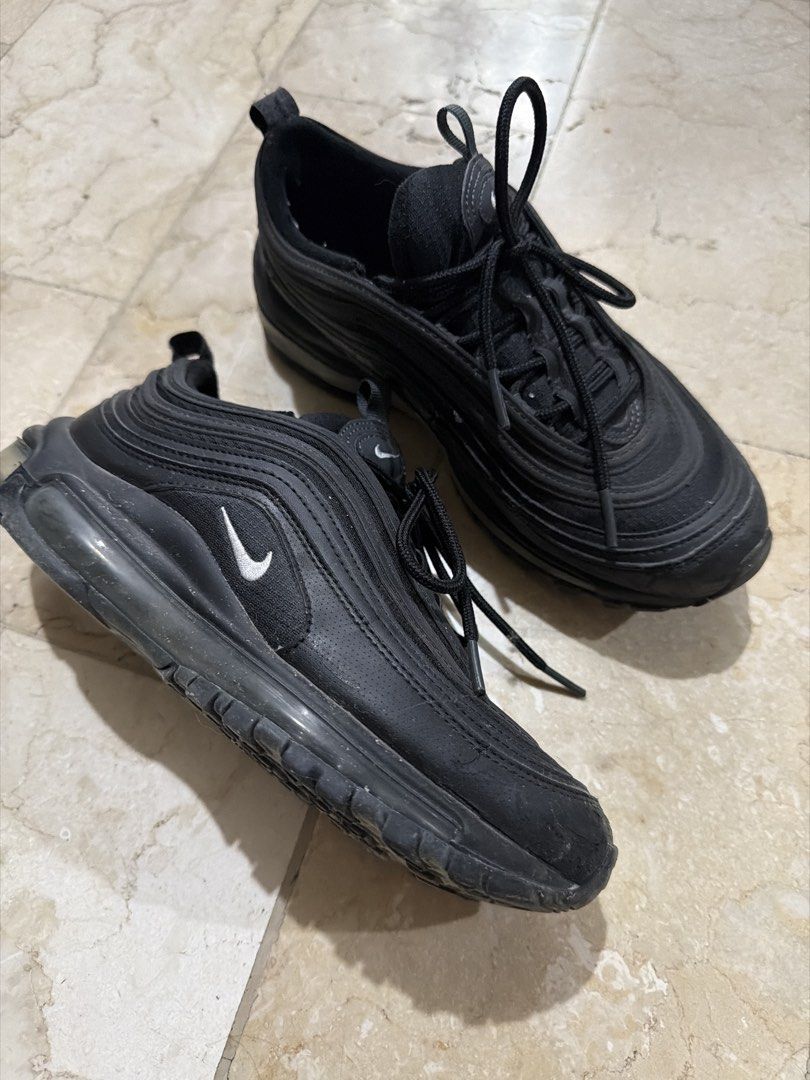 Nike Air Max 97 Triple Black Size 5.5Y (Category: Sneakers) located in Angeles City. Submitted by irishholm (Listing ID 1466214903, Image 1). Description: - Brand/Model: Nike Air Max 97 (Triple Black) - Size: Youth 5.5Y / EUR 38 - Design: Classic wave lines with embroidered white mini swoosh - Comfort: Full-length Max Air cushioning unit - Features: Pull tabs at tongue and heel - Condition: Normal signs of wear on soles and uppers.