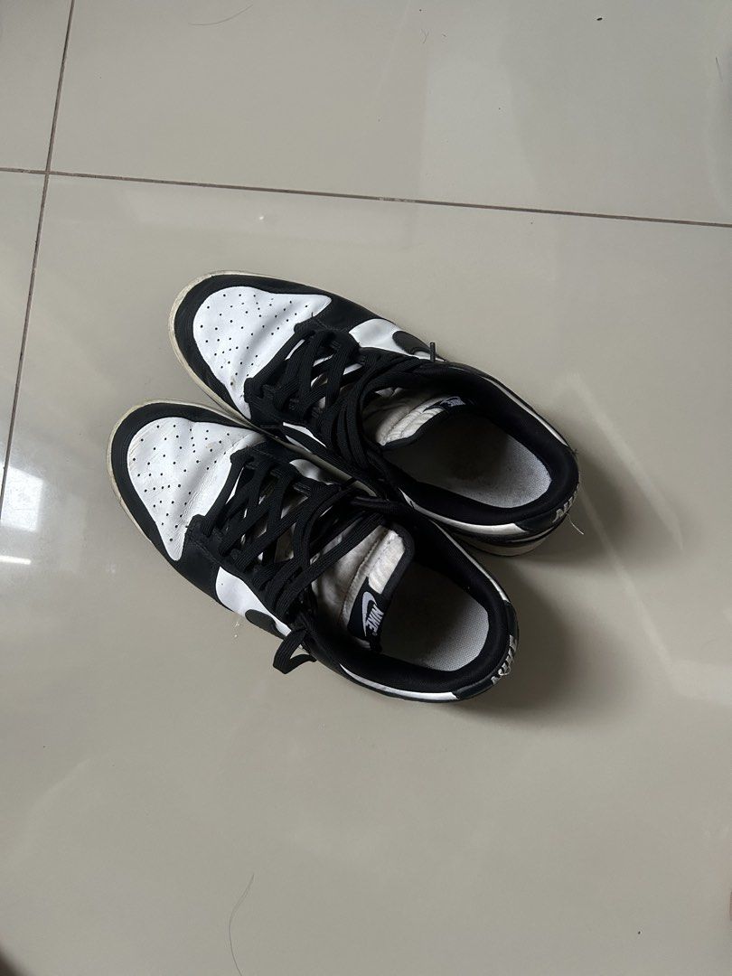 Nike Dunk Low Retro White Black Panda (Category: Sneakers) located in Calamba. Submitted by lancedrew888317 (Listing ID 1466228293, Image 1). Description: - Item: Nike Dunk Low Retro (Black & White) - Size: US 11 / EUR 45 - Material: Premium leather upper with breathable perforated toe box - Condition: Pre-loved with some dirt and wear on the soles, still a solid everyday rotation pair - Style: Iconic monochromatic streetwear sneaker that matches