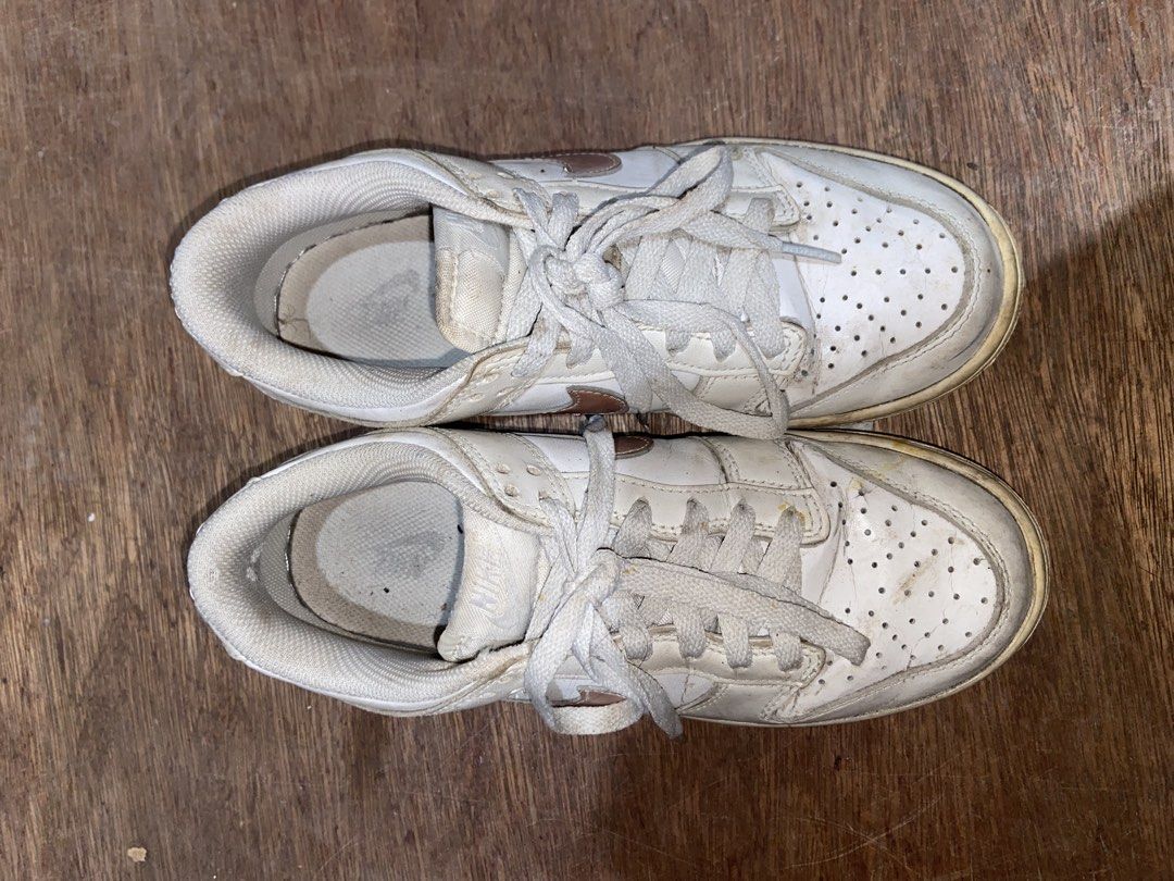 nike dunk white and rose gold (Category: Sneakers) located in Agoo. Submitted by strobeiry (Listing ID 1466298475, Image 1). Description: nego! need cleaning lang. medyo open na rin yung gilid pero i think shoe glue lang need rfs: declutterring .