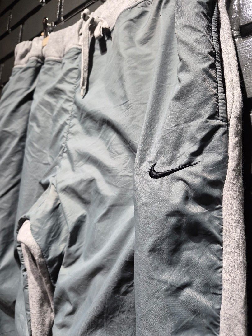 Nike Gray Nylon Mixed Fleece Sweatpants with Drawstring (Category: Joggers) located in Davao. Submitted by rodrigoani57168 (Listing ID 1466335486, Image 3). Description: Baggy Y2K Fleece - Grey Nike track pants - Mix of fleece and nylon panels Adjustable drawstring waist Elasticated cuffs with toggles - Small Nike swoosh logos on front and leg - Ideal for casual wear or workouts - Color Rate: 9.5/10 - No issue -Excellent Condition - Dimes: WaistL