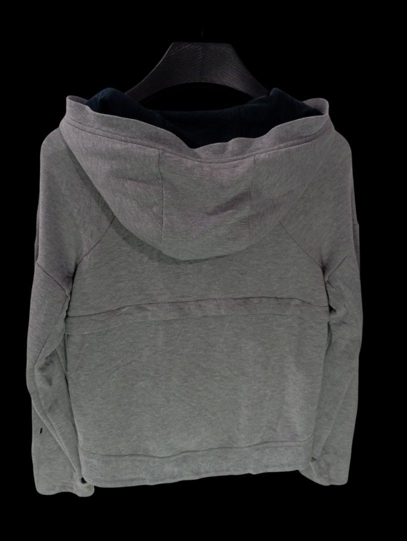 Nike Grey Zip-Up Hoodie Extra Small (Category: Hoodies) located in Rodriguez. Submitted by enzo.tv (Listing ID 1466325964, Image 3). Description: Grey zip-up hoodie from Nike. Black Swoosh logo on the chest. Contrasting dark blue hood lining. Full zipper closure up the front. Tagged extra small size. Measures fourteen inches in length by twelve inches in width..