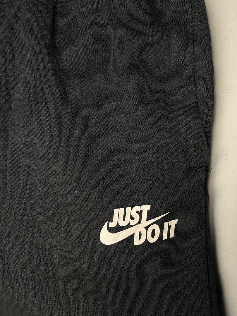 Nike Just Do It Black Sweatpants (Category: Joggers) located in Pasay City. Submitted by Oboyyy (Listing ID 1466192818, Image 2). Description: - Brand: Nike - Style/Product Code: AJ2330-010 - Color: Black with white 'Just Do It' logo near the left pocket - Size: Medium (Regular Fit) - Material: Super comfortable cotton blend - Features: Adjustable drawstring waistband and ribbed ankle cuffs - Condition: Excellent with clean interior labels intact
