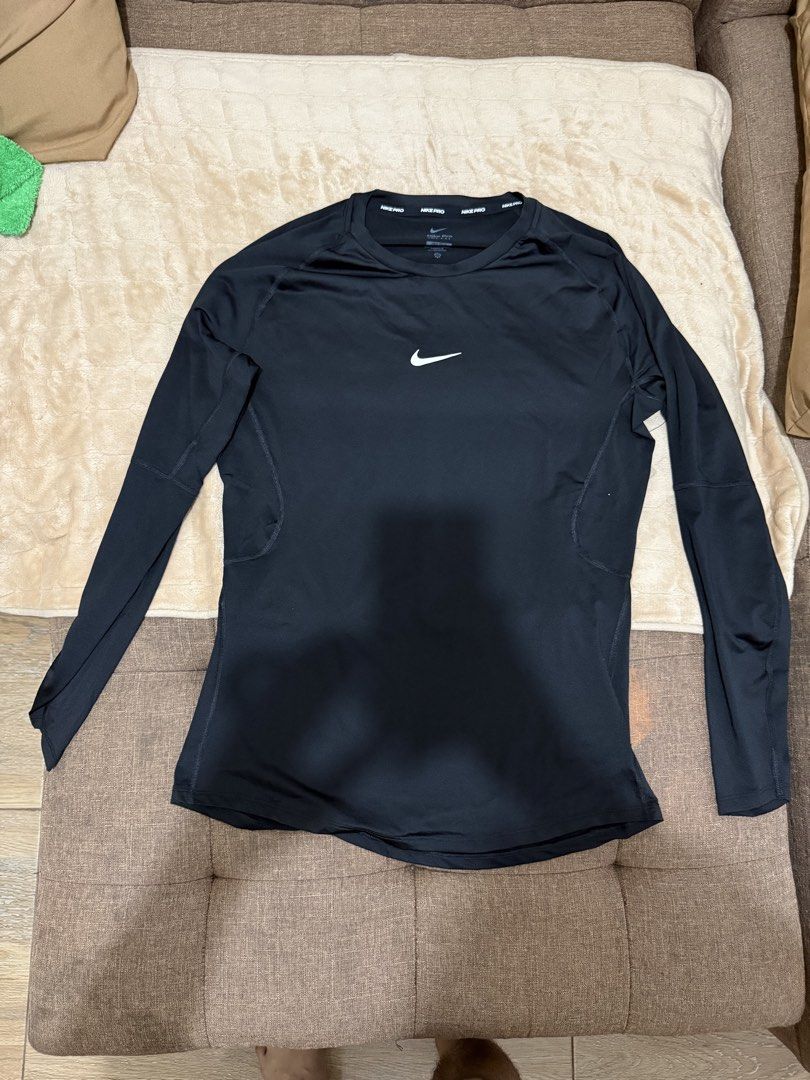 Nike Pro Long Sleeve Compression Top Black Tight Fit Large (Category: Activewear) located in Santa Cruz. Submitted by rexhalili24 (Listing ID 1466327798, Image 2). Description: - Brand New: Nike Pro - Item: Long sleeve compression top - Color: Black with white swoosh - Condition: Brand new with tags attached - Material: Dri-FIT (sweat-wicking and keeps you dry) - Details: Nike Pro branding on inner and back collar - Ideal for: Gym, running, and a