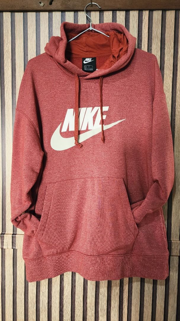 Nike Red Hoodie Size XL (Category: Hoodies) located in Baguio. Submitted by genesisomega (Listing ID 1466277640, Image 1). Description: - Brand: Nike - Color: Red - Size: XL (Standard fit) - Material: Cotton & polyester blend body with 100% cotton hood lining - Origin: Made in Thailand - Condition/Details: Includes original tag showing size and material specs - Ideal for: Comfortable daily wear and casual styling.