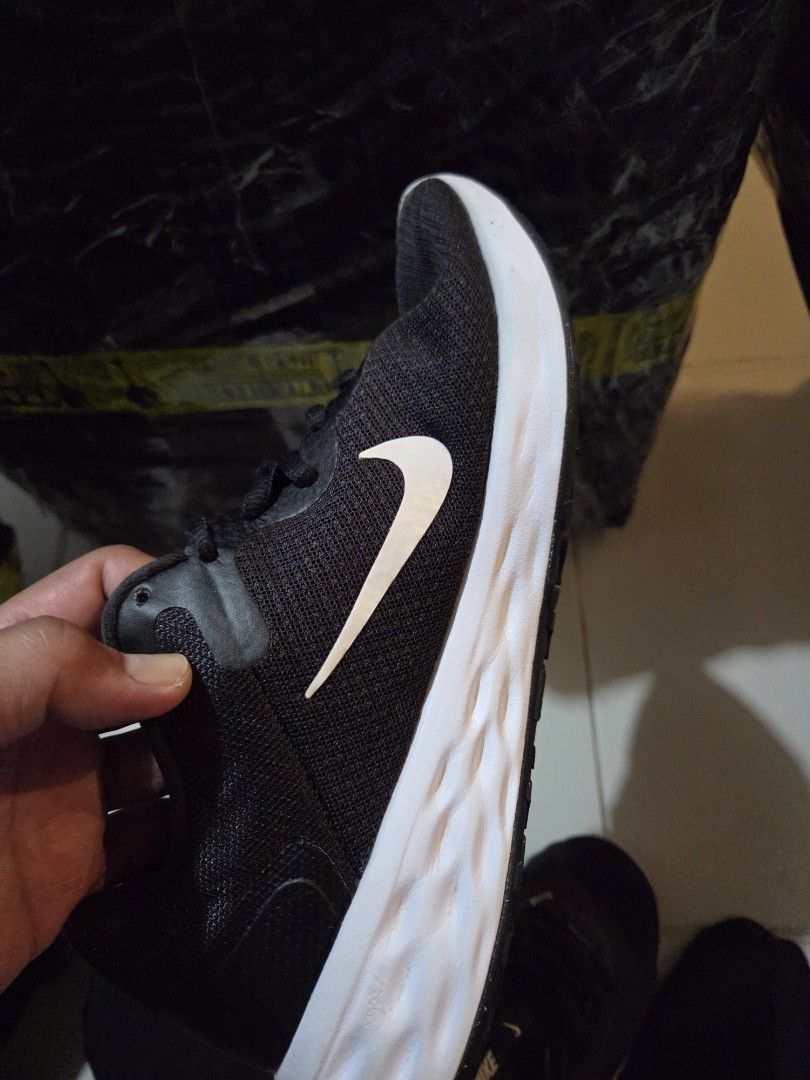 Nike Running Shoes Black White (Category: Sneakers) located in Manila. Submitted by isen45 (Listing ID 1466197861, Image 2). Description: Authentic Nike running shoes in classic black and white. Features a breathable mesh upper, clean soles with minimal wear, and great traction. Perfect for your daily runs or casual fits!.