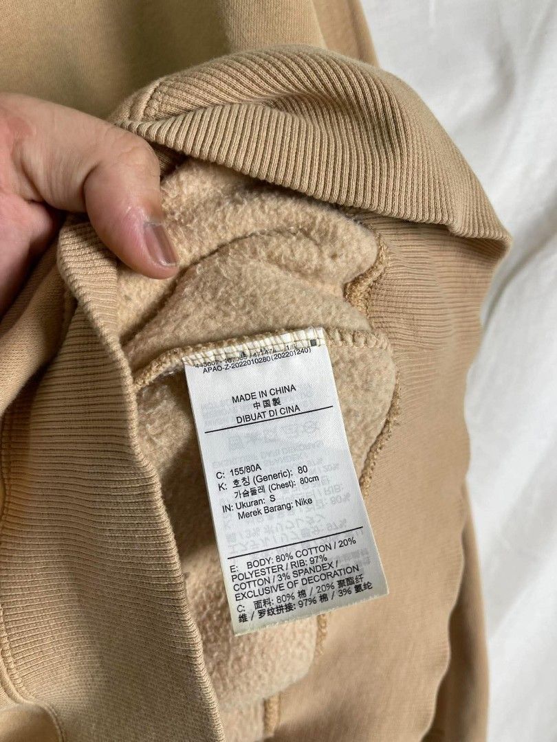 Nike Tan Crewneck Sweatshirt Size S (Category: Coats, Jackets and Outerwear) located in Manila. Submitted by japee55 (Listing ID 1466321539, Image 2). Description: - Brand: Nike - Style: Crewneck sweatshirt - Color: Tan with embroidered white logo on chest - Size: Small (S) - Material: 80% cotton, 20% polyester (Made in China) - Features: Cozy fleece interior, ribbed collar, cuffs, and hem - Condition: Excellent / Ready to ship.
