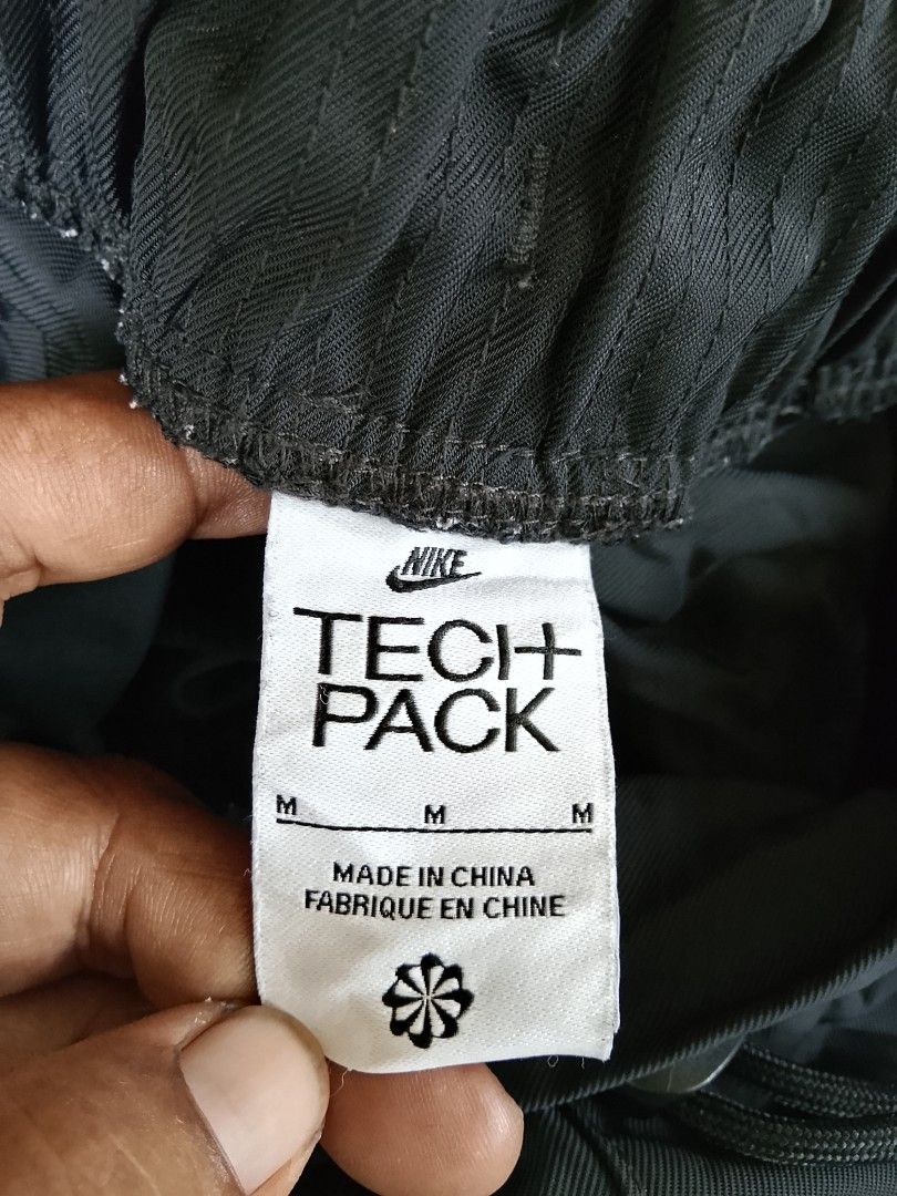 Nike Tech Pack Black Utility Shorts Size M (Category: Shorts) located in Manila. Submitted by arjaygoodfind (Listing ID 1466243937, Image 3). Description: - Brand/Model: Nike Tech Pack Shorts (Style Code: FB7529-010) - Color: Black - Size: Medium (M) - Material: 100% lightweight polyester - Fit: Elastic waistband with adjustable drawstring - Storage: Multiple utility cargo pockets with secure zippers - Condition: Clean, tags intact - Ideal for: G