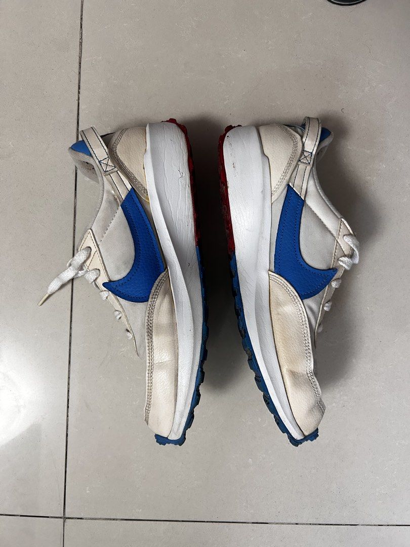Nike Waffle Sneakers (Category: Sneakers) located in Manila. Submitted by bechaydeclutter (Listing ID 1466157524, Image 3). Description: Nike Tom Sachs General Purpose Shoe in the light cream and blue colorway. White canvas upper with royal blue swooshes, red accents on the waffle outsole, and blue heel pull tabs. Orange insoles with classic Nike branding. Worn previously with normal creases and dirt marks on the midsoles and uppers. Classic casu