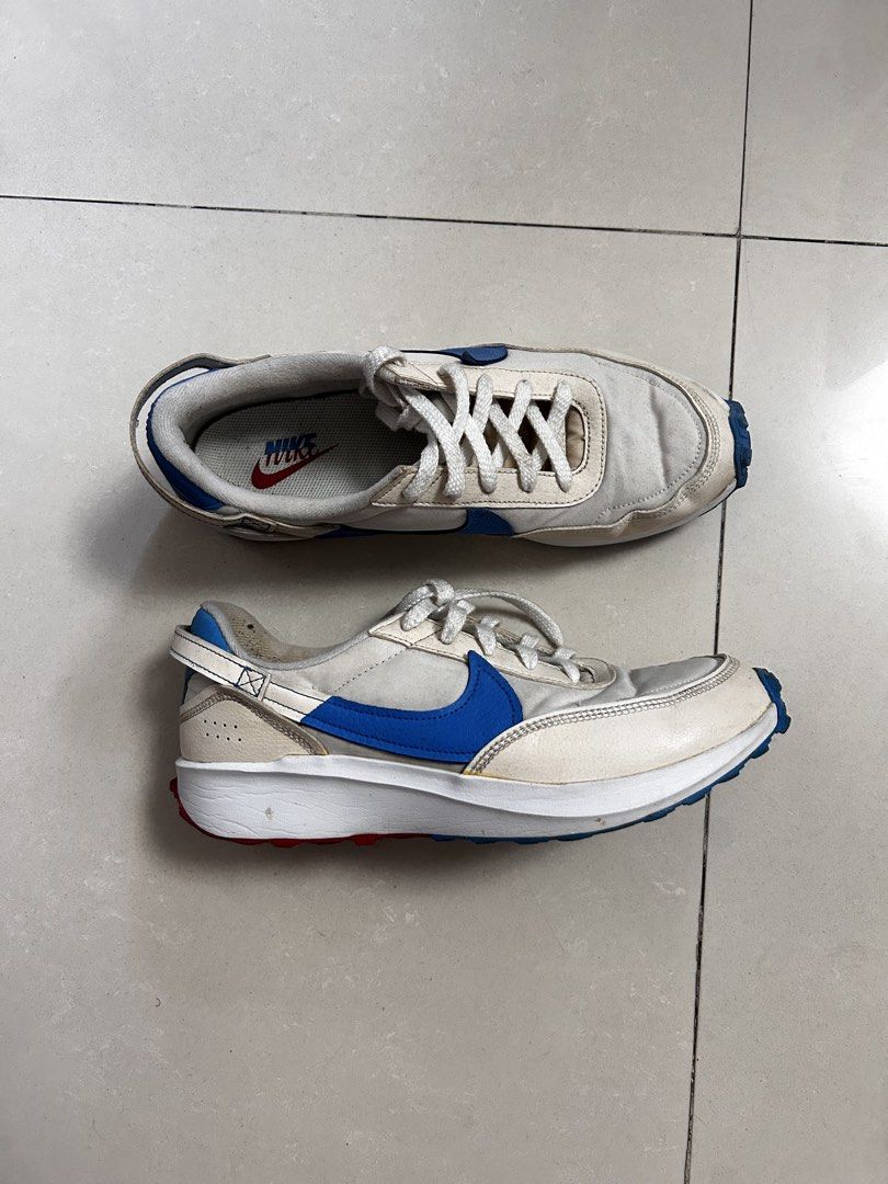 Nike Waffle Sneakers (Category: Sneakers) located in Manila. Submitted by bechaydeclutter (Listing ID 1466157524, Image 1). Description: Nike Tom Sachs General Purpose Shoe in the light cream and blue colorway. White canvas upper with royal blue swooshes, red accents on the waffle outsole, and blue heel pull tabs. Orange insoles with classic Nike branding. Worn previously with normal creases and dirt marks on the midsoles and uppers. Classic casu