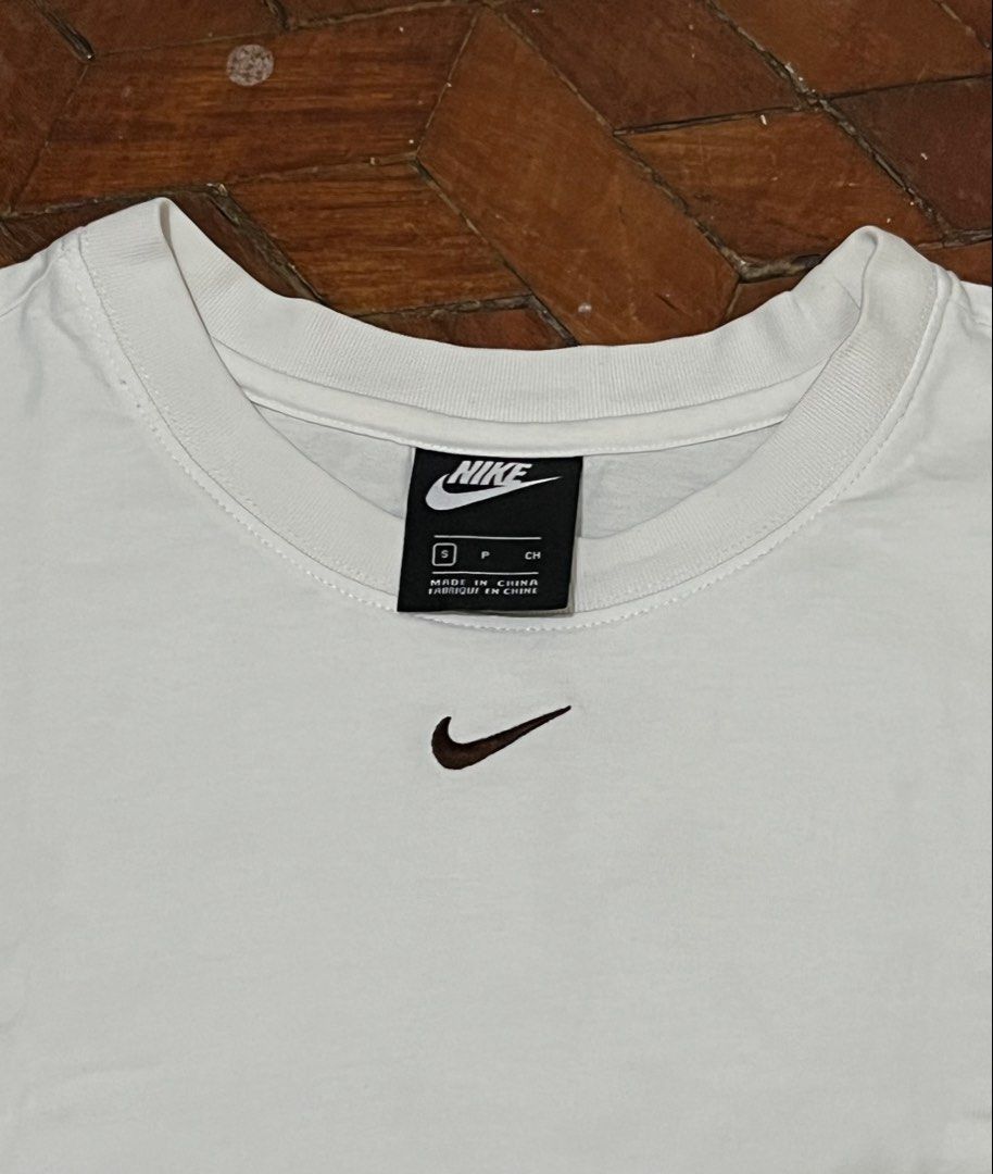 Nike White T-Shirt (Category: Tshirts & Polo Shirts ) located in Manila. Submitted by oloip.thrift (Listing ID 1466314978, Image 2). Description: Size: S to M Dimes: 18/26 Excellent condition No issue Color rate: 10/10.