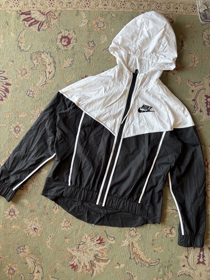 Nike Windrunner Women's zip up jacket (Category: Coats, Jackets and Outerwear) located in General Santos City (Dadiangas). Submitted by scrtshp (Listing ID 1466172351, Image 1). Description: 21x22-25 Size L actual for HER no issue/In excellent condition washed and ready to wear.