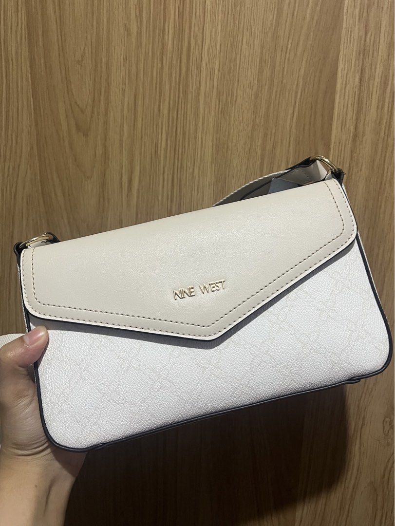 Nine West white crossbody bag (Category: Cross-body Bags) located in Caloocan City. Submitted by declutter_joy (Listing ID 1466289869, Image 1). Description: NO COD PAYMENT FIRST (GCASH) BUYER WILL PAY SF Courier: Lalamove/Grab/Gogoxpress.
