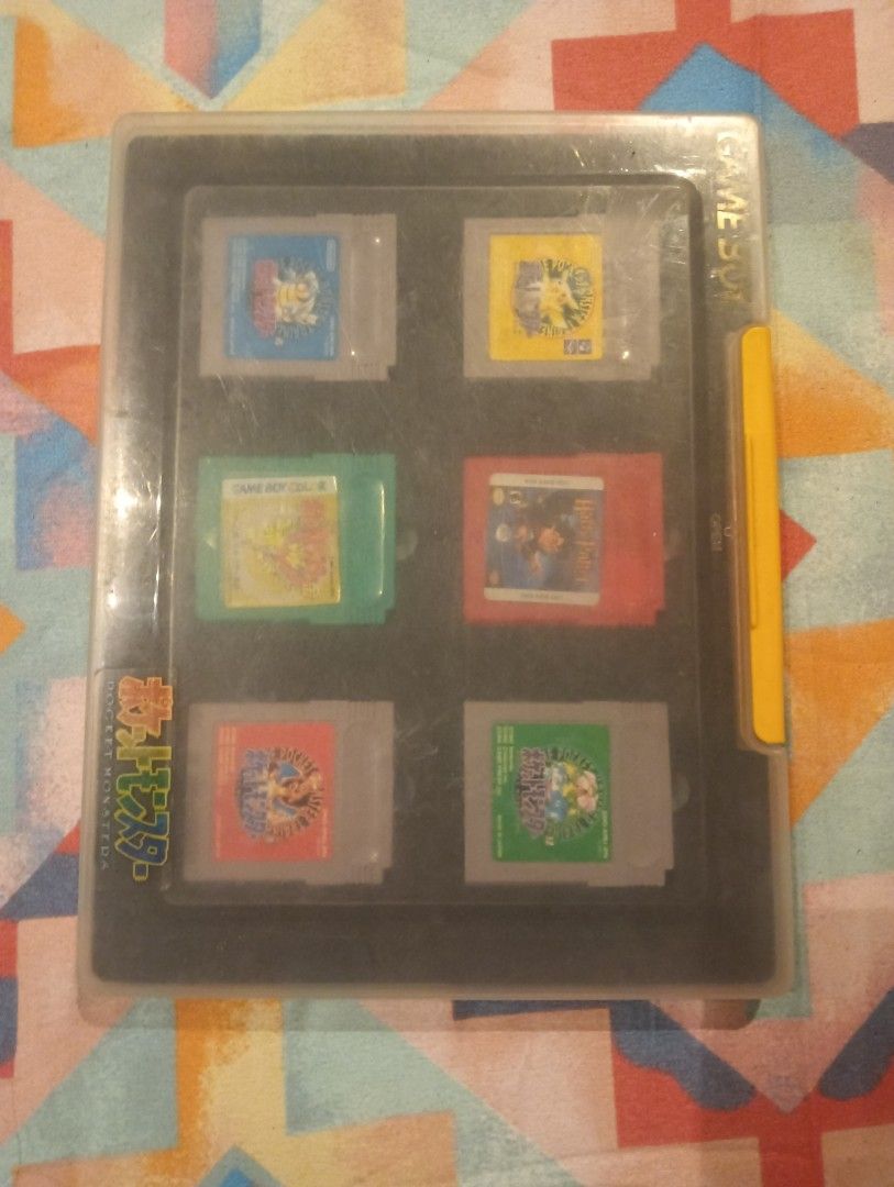 Nintendo Game Boy Cartridge Collection with Storage Case (Category: Nintendo) located in Manila. Submitted by oddrabbit_571255 (Listing ID 1466203416, Image 1). Description: - Bundle includes multiple Game Boy cartridges stored in a protective plastic case - Features Japanese Pokémon variants like Pikachu and Venusaur - Includes Harry Potter and the Sorcerer's Stone cartridge - All game labels are fully intact - Ideal retro gaming set for classic