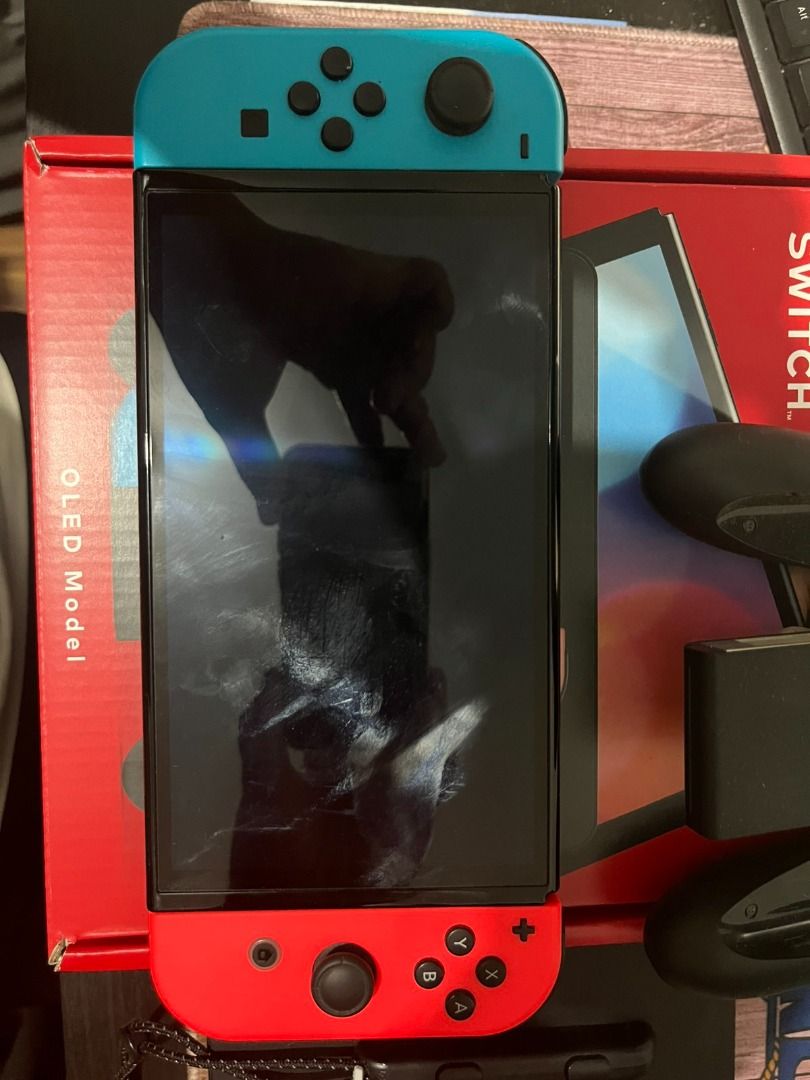 Nintendo Switch OLED (Category: Nintendo) located in Pasig City. Submitted by truebear_1985 (Listing ID 1466248056, Image 3). Description: Selling Nintendo Switch Unit with some bundled Games (Secondary) = 16500 Nintendo Switch OLED 64GB - Includes Box - Switch OLED Console (in latest system update) - Joycons (L and R) with Straps - Nintendo Adaptor - Dock * No Hidden Issues, No Scratches, No Ghost Drifts and not even dropped * I'm sending the li