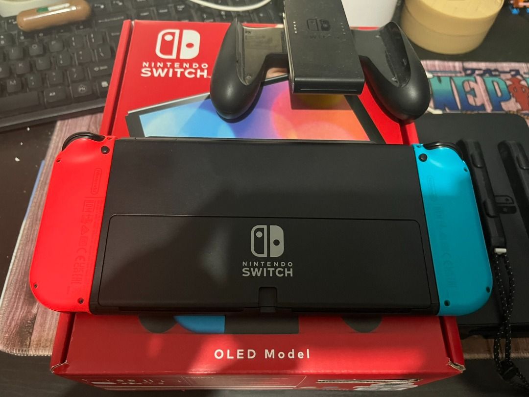 Nintendo Switch OLED (Category: Nintendo) located in Pasig City. Submitted by truebear_1985 (Listing ID 1466248056, Image 2). Description: Selling Nintendo Switch Unit with some bundled Games (Secondary) = 16500 Nintendo Switch OLED 64GB - Includes Box - Switch OLED Console (in latest system update) - Joycons (L and R) with Straps - Nintendo Adaptor - Dock * No Hidden Issues, No Scratches, No Ghost Drifts and not even dropped * I'm sending the li