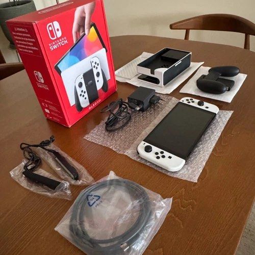 Nintendo Switch OLED White (Category: Nintendo) located in Manila. Submitted by bcanar88 (Listing ID 1466330414, Image 3). Description: Nintendo Switch OLED – White + 3 Games + Hard Case 📌 Color: White 📌 Condition: Like New / Barely Used 📌 Usage: Very lightly used — never used for more than 1 hour per session 📌 Screen protector since day 1 Selling my Nintendo Switch OLED White in excellent condition. Well maintained and barely used. Perfect f