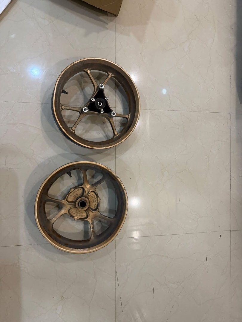 NMAX MAGS STOCK V2 (Category: Mags and Tires) located in Caloocan City. Submitted by guccidais (Listing ID 1466197643, Image 1). Description: - Product: Yamaha NMAX Stock V2 Mags - Color: Bronze / Gold finish - Condition: Used in good working condition - Compatibility: Fits Yamaha NMAX V2 models - Meetup Location: SM Fairview Terminal, Novaliches, Quezon City.