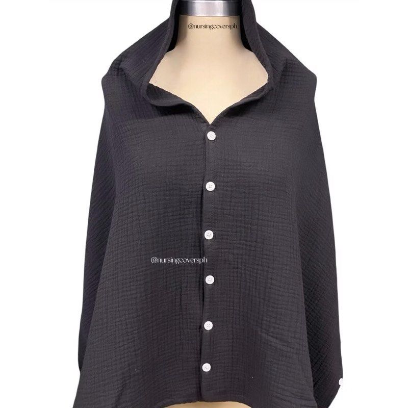 Nursing Covers PH - Multiway Nursing Poncho in Black (Category: Coats, Jackets and Outerwear) located in Manila. Submitted by vydeleon (Listing ID 1466336518, Image 1). Description: - Color: Versatile solid black - Material: Lightweight and breathable muslin gauze - Design: Poncho style with full front button placket and hood - Portability: Folds up small to fit easily in any diaper bag - Function: Provides full coverage for comfortable nursing o