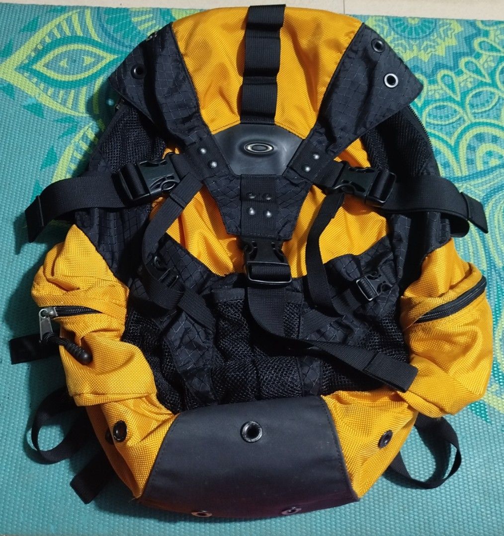 Oakley Software Yellow Black Backpack (Category: Backpacks) located in Taguig. Submitted by giango1313 (Listing ID 1466257535, Image 1). Description: - Brand: Oakley Software - Colorway: Striking yellow and black - Design: Rugged build with textured fabric and reinforced bottom panels - Storage: Multiple exterior utility straps, integrated mesh pockets, and official woven interior tag - Comfort: Padded shoulder straps with sternum strap and metal