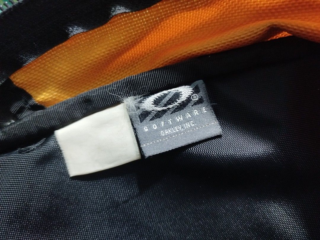 Oakley Software Yellow Black Backpack (Category: Backpacks) located in Taguig. Submitted by giango1313 (Listing ID 1466257535, Image 3). Description: - Brand: Oakley Software - Colorway: Striking yellow and black - Design: Rugged build with textured fabric and reinforced bottom panels - Storage: Multiple exterior utility straps, integrated mesh pockets, and official woven interior tag - Comfort: Padded shoulder straps with sternum strap and metal