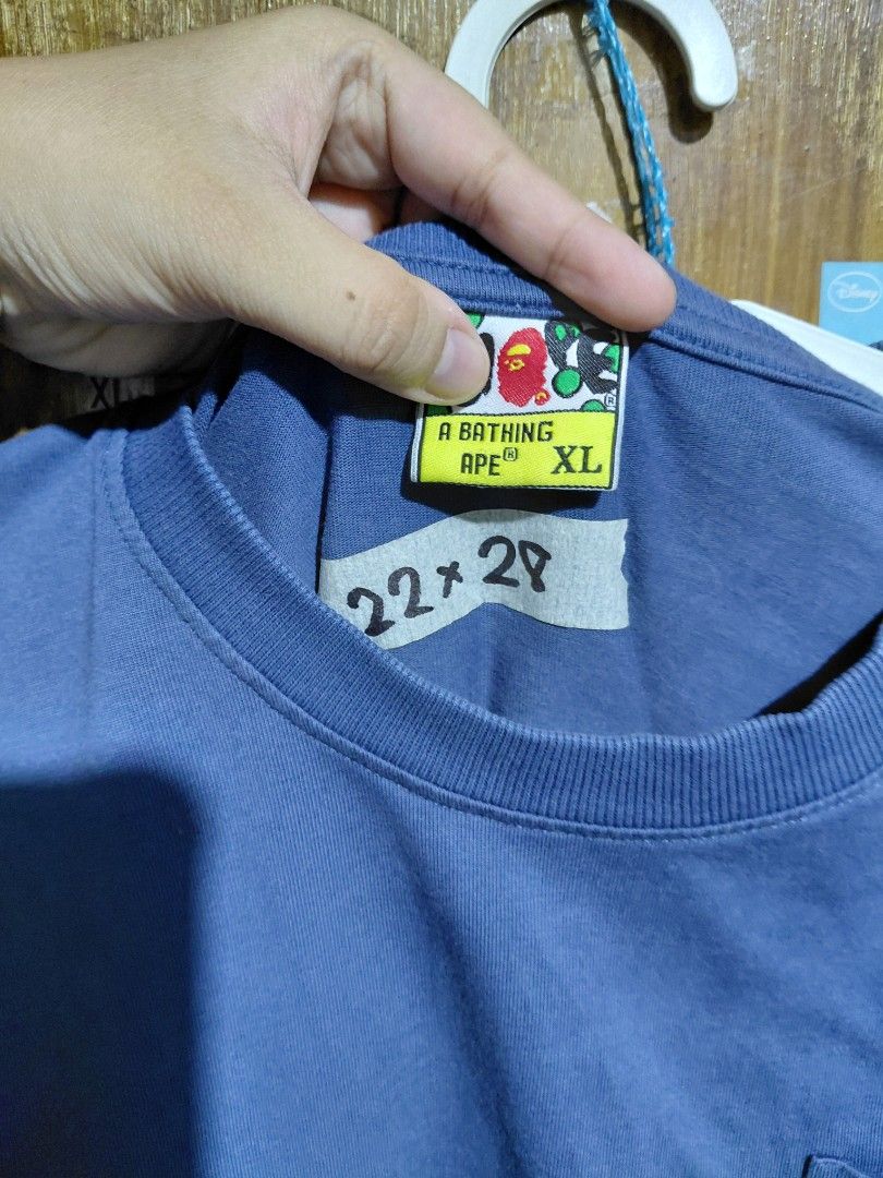 OFF A Bathing Ape Pocket Tee Blue Size XL (Category: Tshirts & Polo Shirts ) located in Imus. Submitted by frootiloots4103 (Listing ID 1466313216, Image 3). Description: - Brand: A Bathing Ape (BAPE) - Color: Blue - Size: XL (Measures 22" pit-to-pit by 29" length) - Details: Chest pocket with brand tag, small sleeve logo - Quality: Thick collar, great weight, clean fabric - Condition: Excellent daily streetwear basic OPEN FOR NEGO (best if aspack