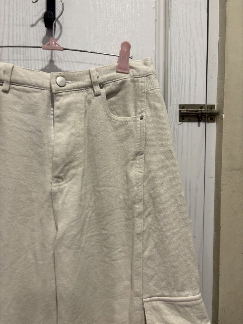 Off-white Cargo Pants Size 27-28 (Category: Jeans) located in Mandaluyong City. Submitted by shopwithjuu (Listing ID 1466161848, Image 2). Description: Off-white wide-leg cargo pants in size 27-28. Features utility pockets, a relaxed fit, and a neutral cream shade that pairs easily with any top..