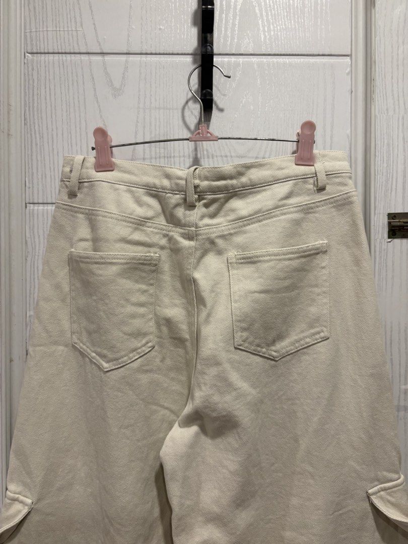 Off-white Cargo Pants Size 27-28 (Category: Jeans) located in Mandaluyong City. Submitted by shopwithjuu (Listing ID 1466161848, Image 3). Description: Off-white wide-leg cargo pants in size 27-28. Features utility pockets, a relaxed fit, and a neutral cream shade that pairs easily with any top..