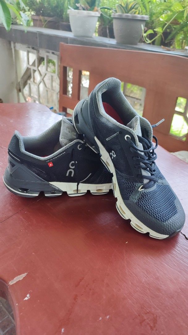 On Cloud Running Shoes (Category: Sneakers) located in Quezon City. Submitted by rapstoreph (Listing ID 1466169226, Image 3). Description: ...not authentic... - Model: Running shoes in Dark Navy and Grey - Size: US W9 / EUR 40.5 (woman size) - Sole: CloudTec setup with distinct white and black pods - Upper: Breathable mesh material for ventilation - Condition: Minor wear on treads and insoles, still plenty of miles left.