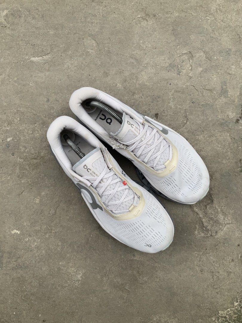 On Running Cloudmonster 2 Grey White Trainers (Category: Sneakers) located in Cavite. Submitted by thriftkicks3 (Listing ID 1466242101, Image 3). Description: - Brand/Model: On Running Cloudmonster 2 - Color: Grey and White - Size: EU 44 / US 10 / UK 9 - Features signature thick CloudTec sole for superior cushioning and impact absorption - Breathable mesh upper with secure lace-up closure - Stylish everyday athletic trainers suitable for running 