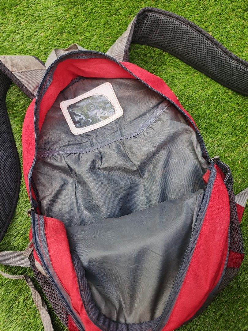 Onepolar Red Grey Sport Backpack (Category: Backpacks) located in Dipolog. Submitted by vinzz_thrift (Listing ID 1466196730, Image 3). Description: - Color: Red and Grey - Brand: Onepolar - Breathable mesh back padding for all-day comfort - Adjustable chest strap and sturdy straps with secure buckles - Multiple front zip compartments and side mesh pockets - Main interior features a convenient name tag pocket - Ideal size for daily commutes, schoo