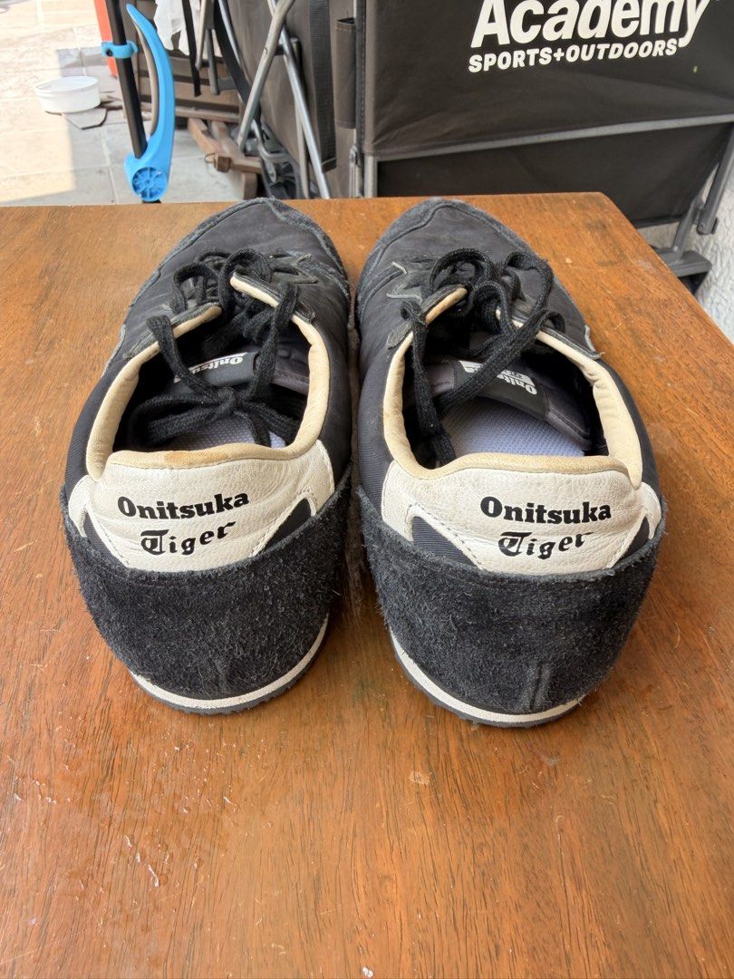 Onitsuka Tiger Black Sneakers US 11.5 (Category: Sneakers) located in Paranaque City. Submitted by ramonbalag16513 (Listing ID 1466334680, Image 2). Description: Black Onitsuka Tiger sneakers with suede toe panels and textured rubber outsoles. Size US 11.5, EU 46, CM 29.0. Classic low-top design with black laces, contrast inner collar, and branding on the heel tab and insoles. RFS too narrow for my feet.