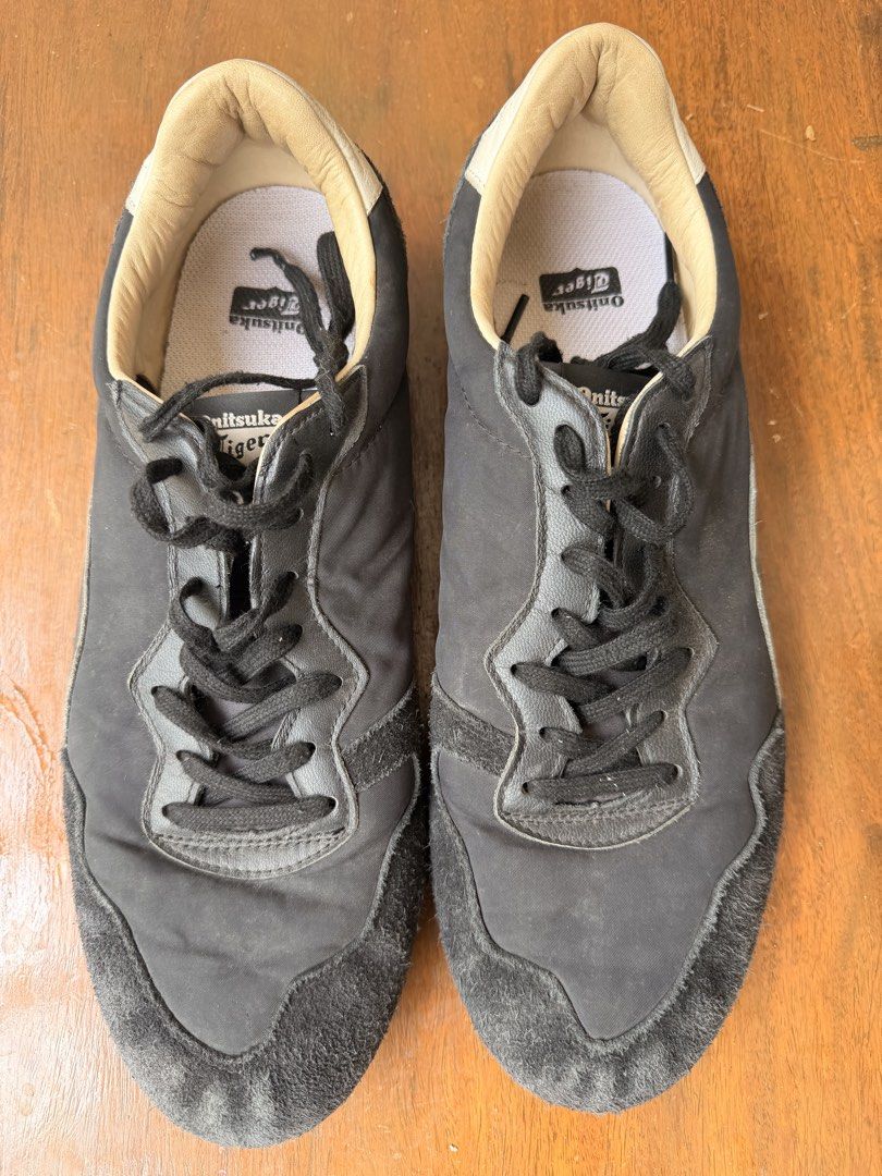 Onitsuka Tiger Black Sneakers US 11.5 (Category: Sneakers) located in Paranaque City. Submitted by ramonbalag16513 (Listing ID 1466334680, Image 1). Description: Black Onitsuka Tiger sneakers with suede toe panels and textured rubber outsoles. Size US 11.5, EU 46, CM 29.0. Classic low-top design with black laces, contrast inner collar, and branding on the heel tab and insoles. RFS too narrow for my feet.
