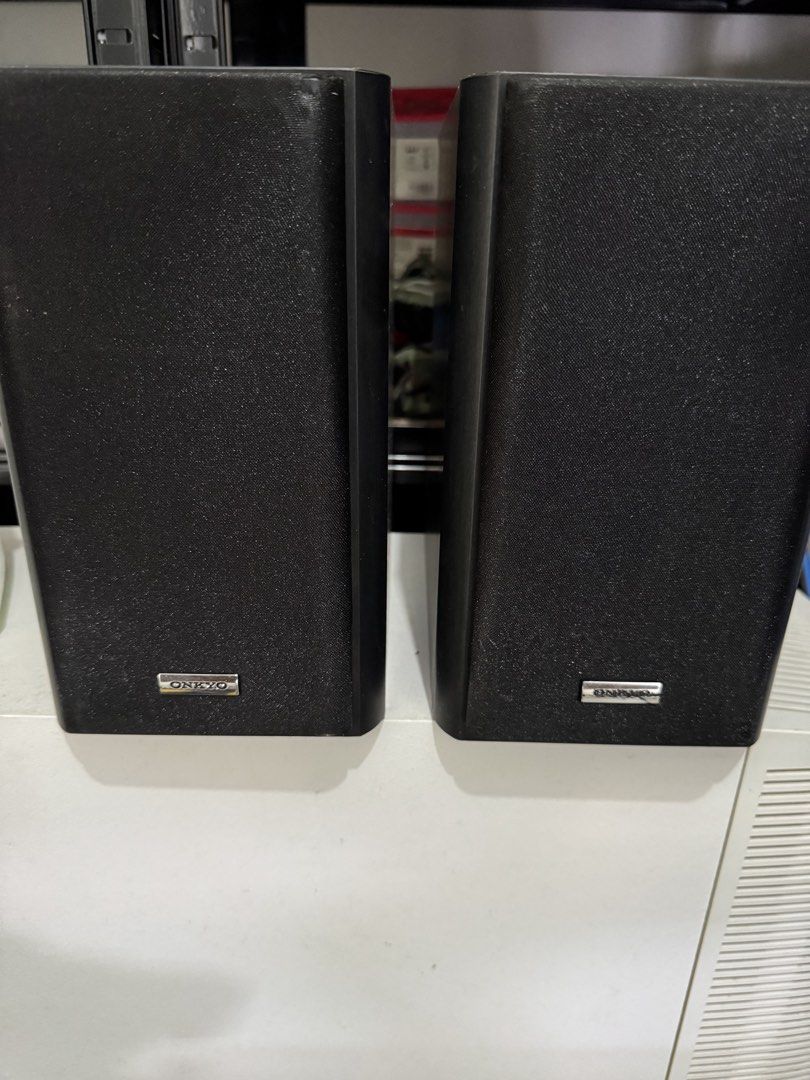 Onkyo D-035 Bookshelf Speakers Pair (Category: Soundbars, Speakers & Amplifiers) located in Cavite. Submitted by marcuz1316 (Listing ID 1466253775, Image 3). Description: - Brand: Onkyo - Model: D-035 (Made in Malaysia) - Color: Black housing with striking white woofer cones and dome tweeters - Specs: 4 ohms impedance, 40W max power handling - Condition: Tested and working 100% fine - Inclusions: Original front grilles with metal Onkyo badges.