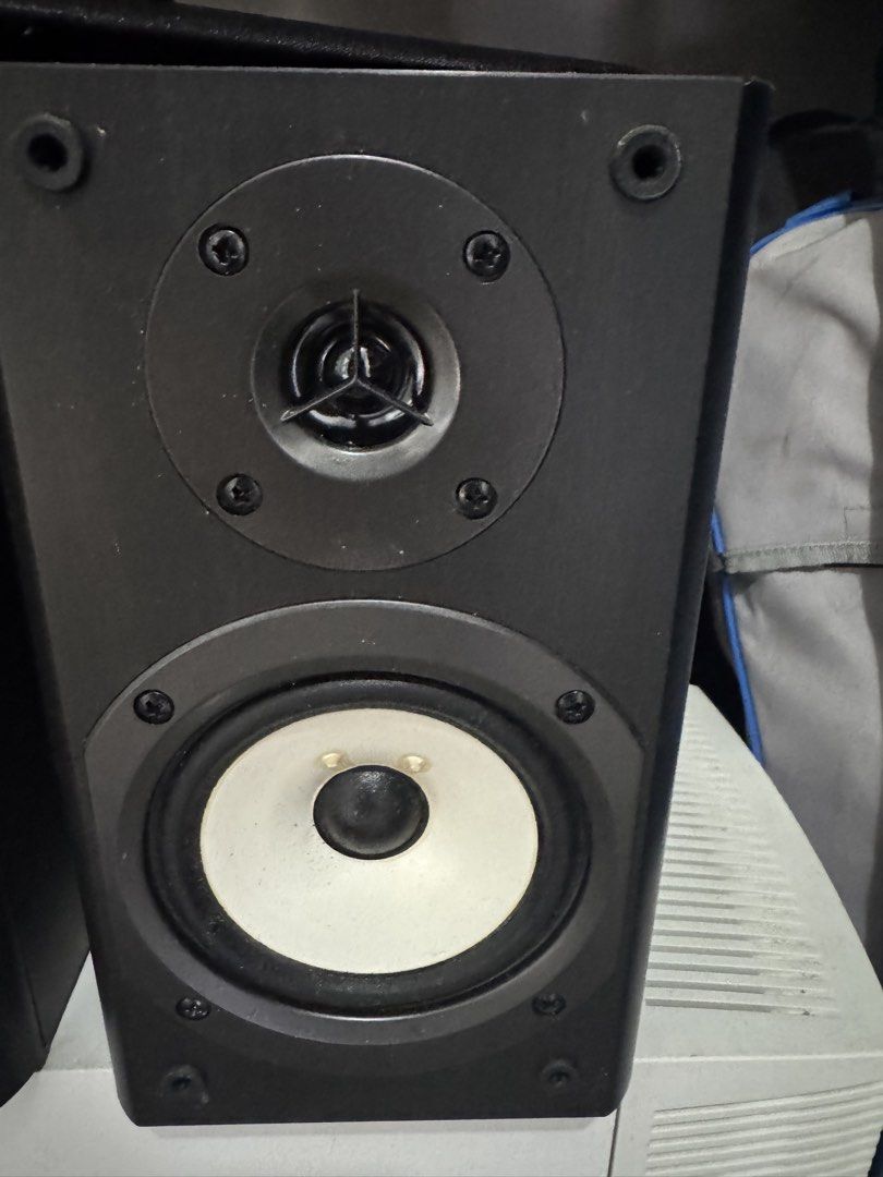 Onkyo D-035 Bookshelf Speakers Pair (Category: Soundbars, Speakers & Amplifiers) located in Cavite. Submitted by marcuz1316 (Listing ID 1466253775, Image 2). Description: - Brand: Onkyo - Model: D-035 (Made in Malaysia) - Color: Black housing with striking white woofer cones and dome tweeters - Specs: 4 ohms impedance, 40W max power handling - Condition: Tested and working 100% fine - Inclusions: Original front grilles with metal Onkyo badges.