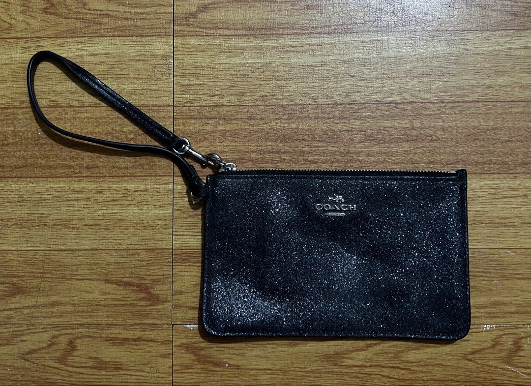 Original coach black star glitter wristlet wallet (Category: Wallets & Card holders) located in Manila. Submitted by baeshop16 (Listing ID 1466323865, Image 1). Description: Likenew .