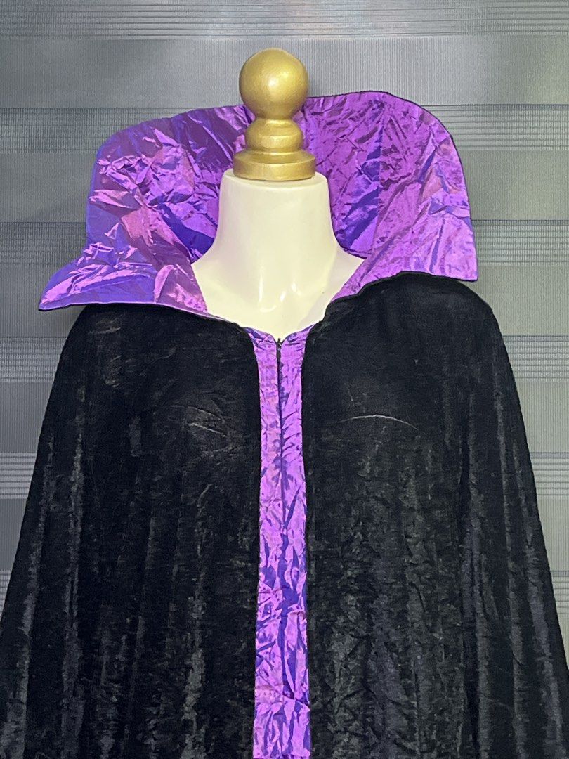 ORIGINAL DISNEY MALEFICENT costume cape gown (Category: Evening dresses & gowns) located in Caloocan City. Submitted by unicakczxc (Listing ID 1466302076, Image 2). Description: ORIGINAL DISNEY MALEFICENT costume cape gown ONE SIZE FITS ALL UP TO XXL 1,500 ONLY ORIGINAL DISNEY - Long black velvet cloak with dramatic purple collar and center stripe - Tattered jagged hemline and sleeves with purple lining - Convenient front zipper closure - Perfect
