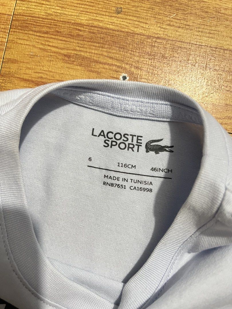 Original lacoste sport shirt (Category: Babies & Kids Fashion) located in Manila. Submitted by baeshop16 (Listing ID 1466324402, Image 3). Description: Likenew Solidprint 6a No issue.