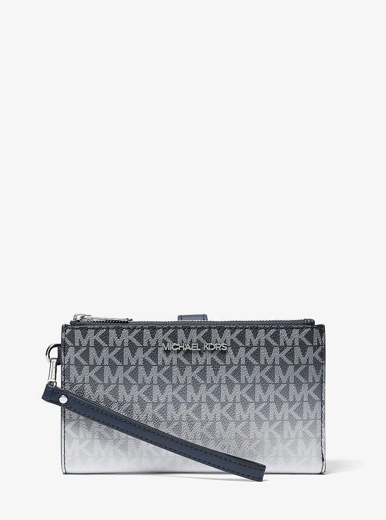Original MK Jet Set Limited edt (Category: Wallets & Card holders) located in Manolo Fortich. Submitted by luxebox_quin (Listing ID 1466291630, Image 1). Description: Original with complete inclusion with box Bought in Canada Original Price: ₱14,000 Fits a ohone inside.