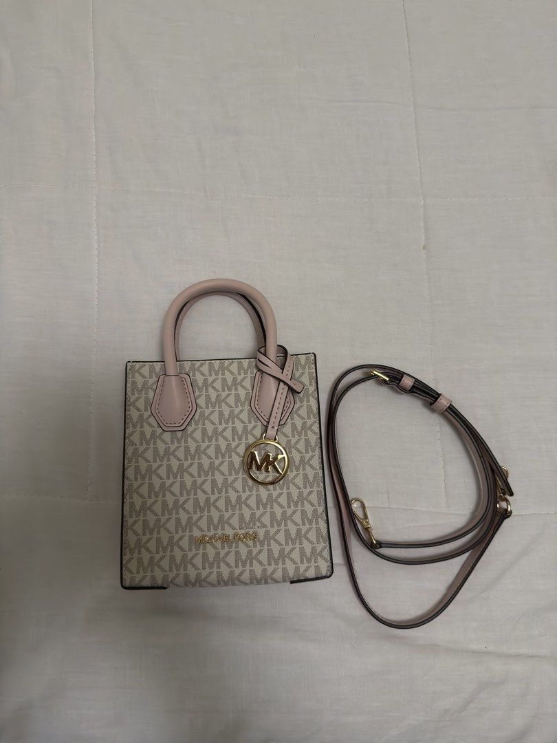 Original MK pink small bag (Category: Cross-body Bags) located in Paranaque City. Submitted by posh.mnl08 (Listing ID 1466329412, Image 1). Description: No issue Good condition Small size can fit only phone and cards.
