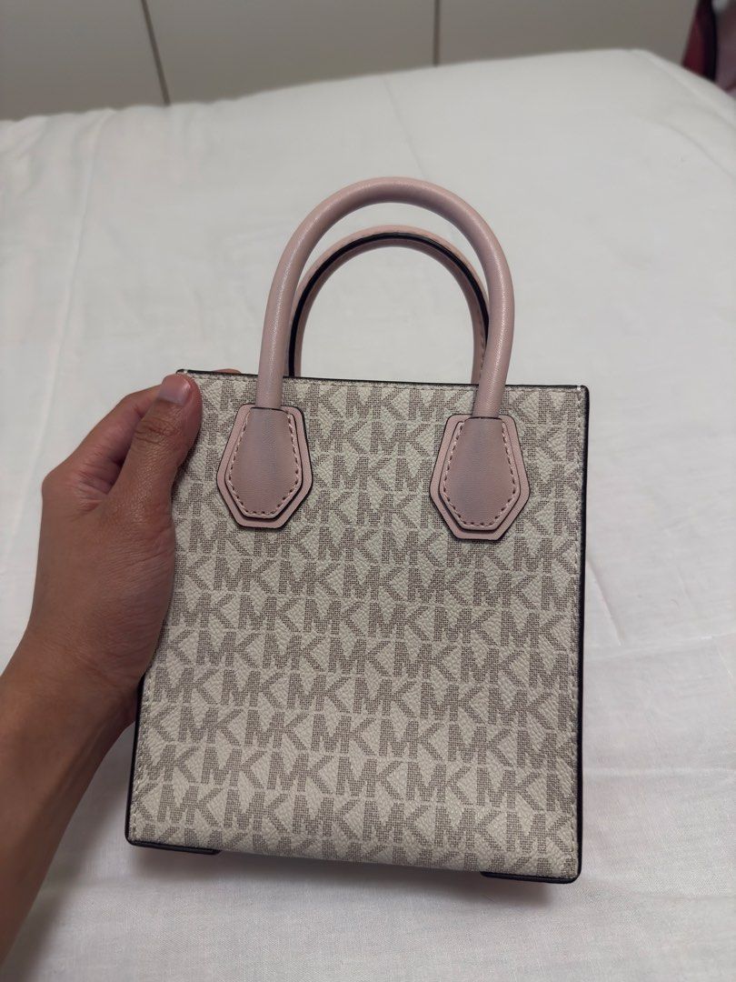 Original MK pink small bag (Category: Cross-body Bags) located in Paranaque City. Submitted by posh.mnl08 (Listing ID 1466329412, Image 3). Description: No issue Good condition Small size can fit only phone and cards.