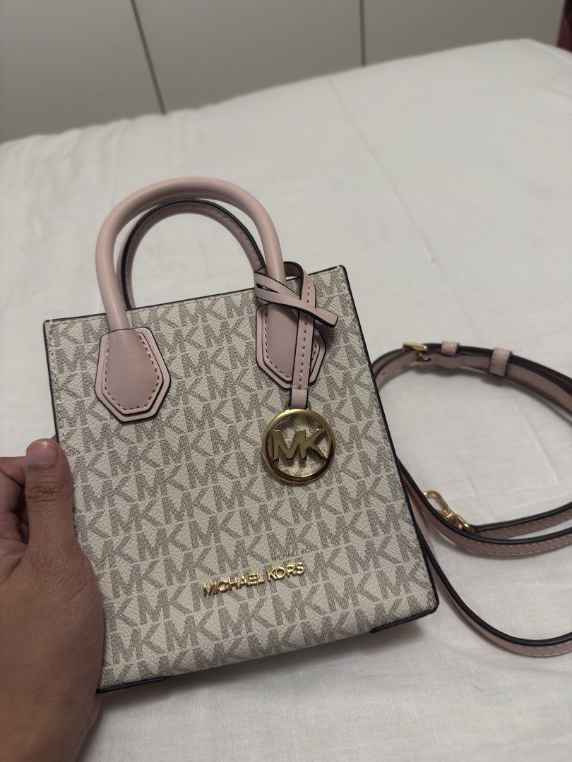 Original MK pink small bag (Category: Cross-body Bags) located in Paranaque City. Submitted by posh.mnl08 (Listing ID 1466329412, Image 2). Description: No issue Good condition Small size can fit only phone and cards.
