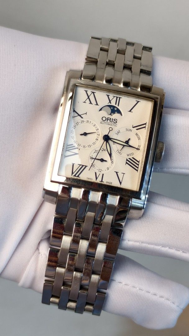 Oris rectangular complication moonphase watch (Category: Watches) located in Butterworth. Submitted by adamchew88 (Listing ID 1466199631, Image 3). Description: Oris 7658 46x33mm diameter Caliber 581 automatic movement Day date , 24 hours, moon phase function Watch with box Warranty for 1 year .