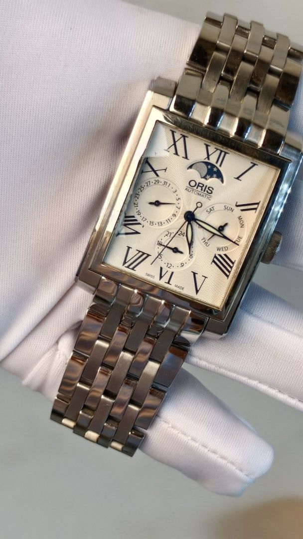Oris rectangular complication moonphase watch (Category: Watches) located in Butterworth. Submitted by adamchew88 (Listing ID 1466199631, Image 2). Description: Oris 7658 46x33mm diameter Caliber 581 automatic movement Day date , 24 hours, moon phase function Watch with box Warranty for 1 year .